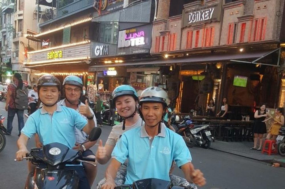 Hanoi Trang Tien Plaza Entrance At Night With Motorbike Traffic