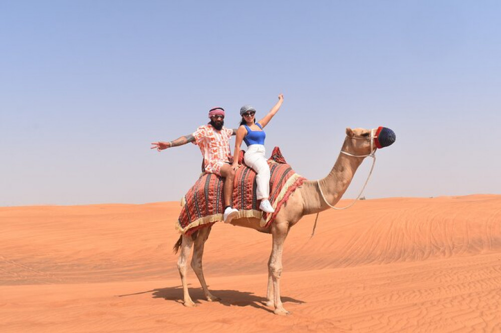 Private Desert Excursion Camel Ride Sandboard & Buffet BBQ Dinner