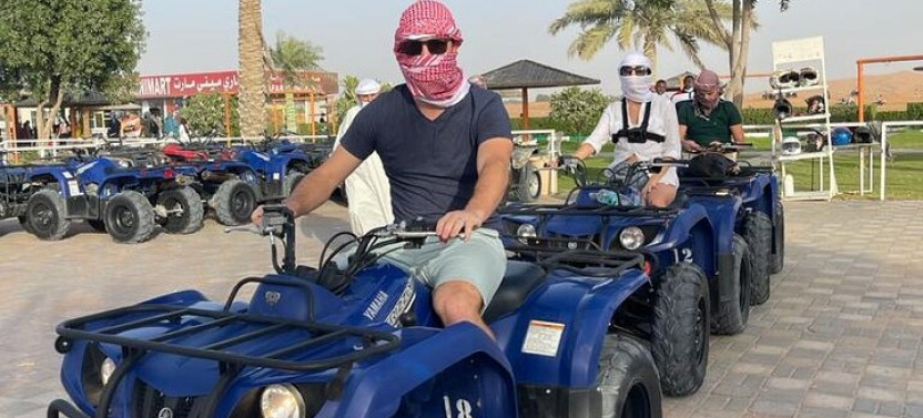 4 Hours Desert Tour with Quad Bike Camel Ride & Sandboard