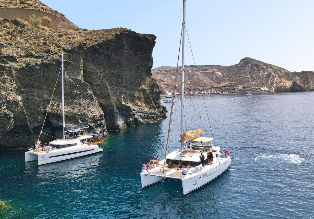 Santorini Catamaran Day Cruise with Lunch, BBQ, Drinks and Transfers