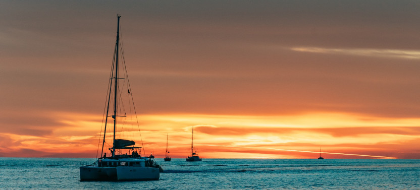 Private Sunset Sailing Catamaran Cruise with BBQ, Open bar & Transfers
