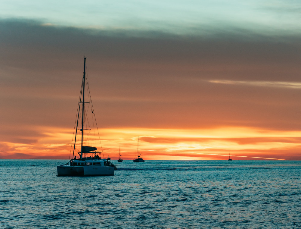 Private Sunset Sailing Catamaran Cruise with BBQ, Open bar & Transfers