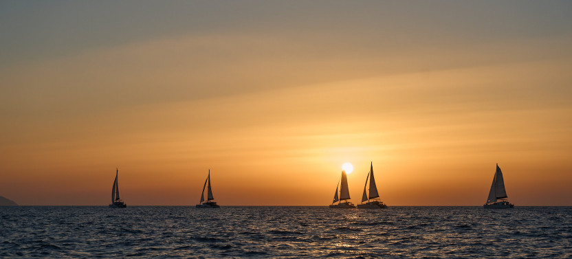 Private Sunset Catamaran Cruise with BBQ, Open Bar & Exclusive Transfers