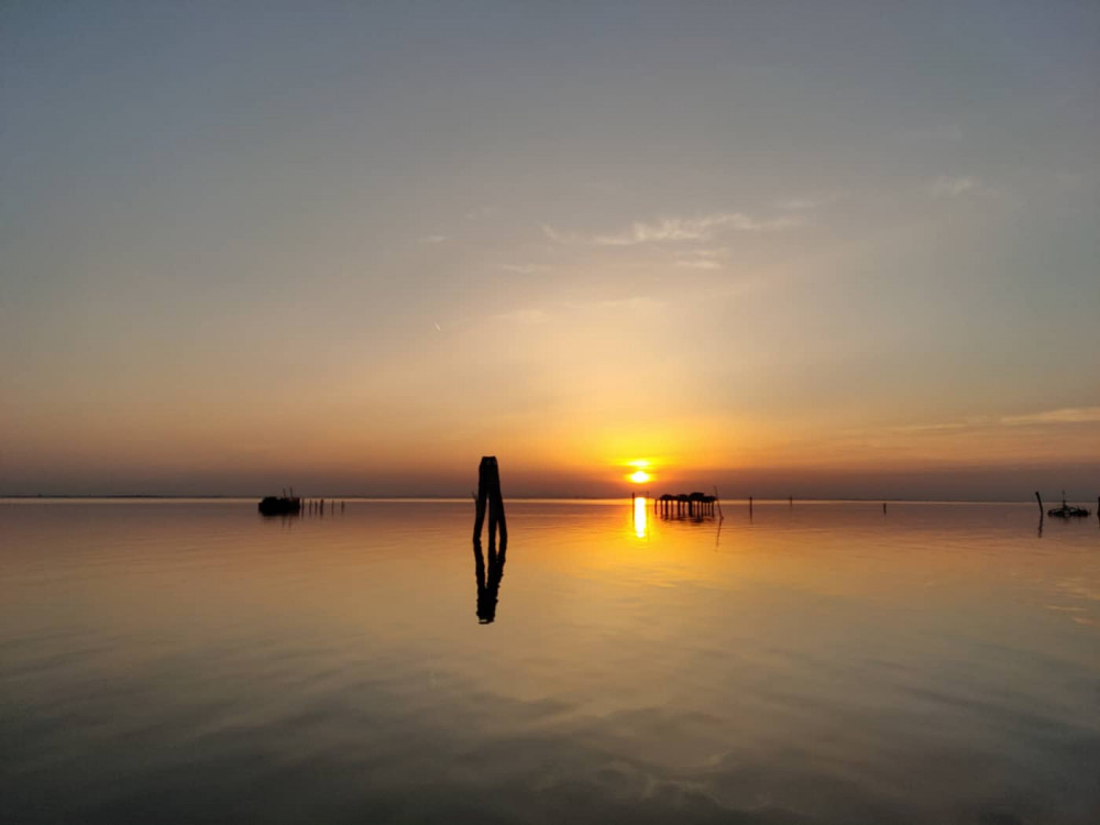 Golden Hour in the Venetian Lagoon by Boat