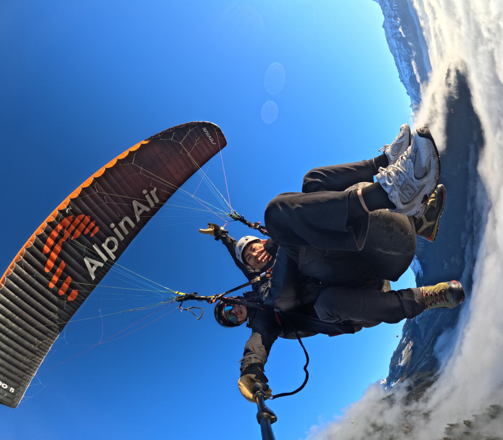 Tandem Paragliding Flight Over Interlaken and Swiss Alps Peaks