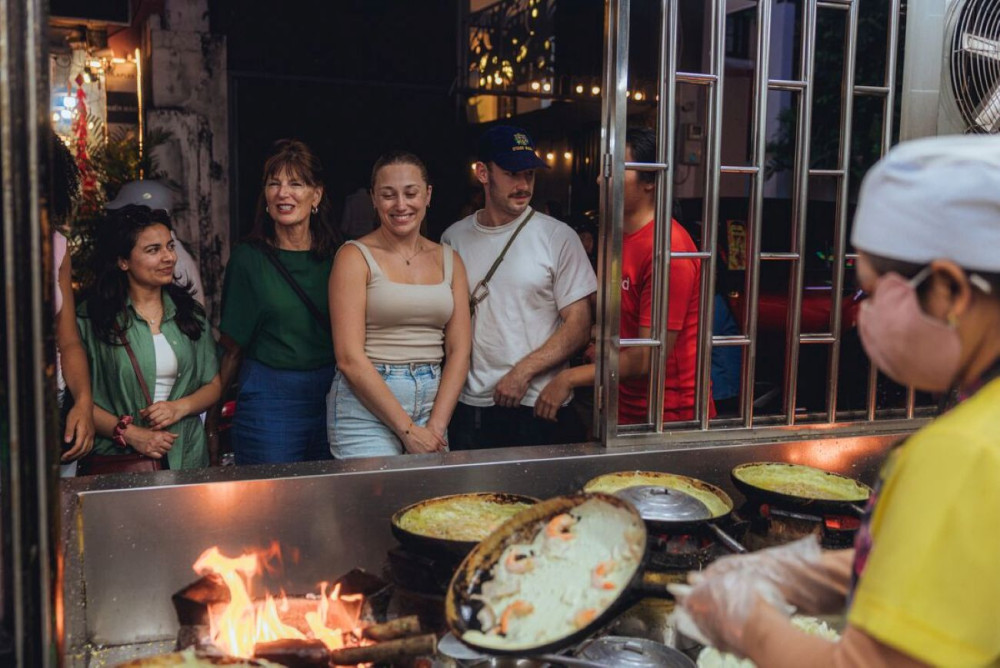 Private Saigon Street Food by Night Experience by Intrepid