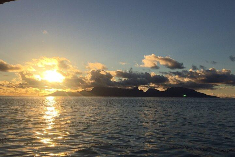 Shared Polynesian Sunset Sailing Tour with Option to Swim