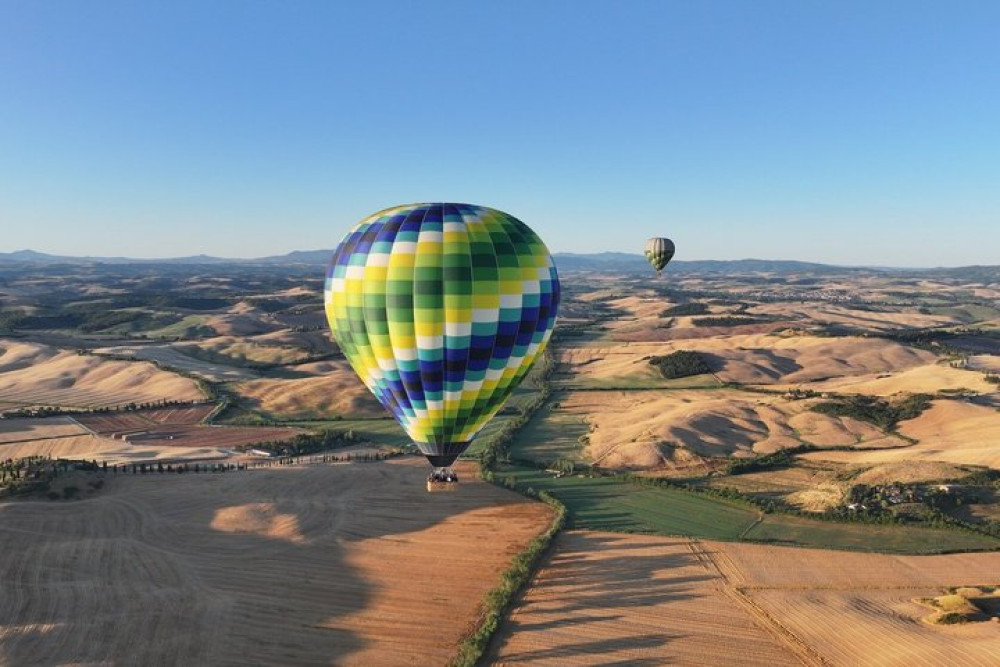 Hot Air Balloon Over The Hills Of Pienza, Montalcino And Val D'orcia