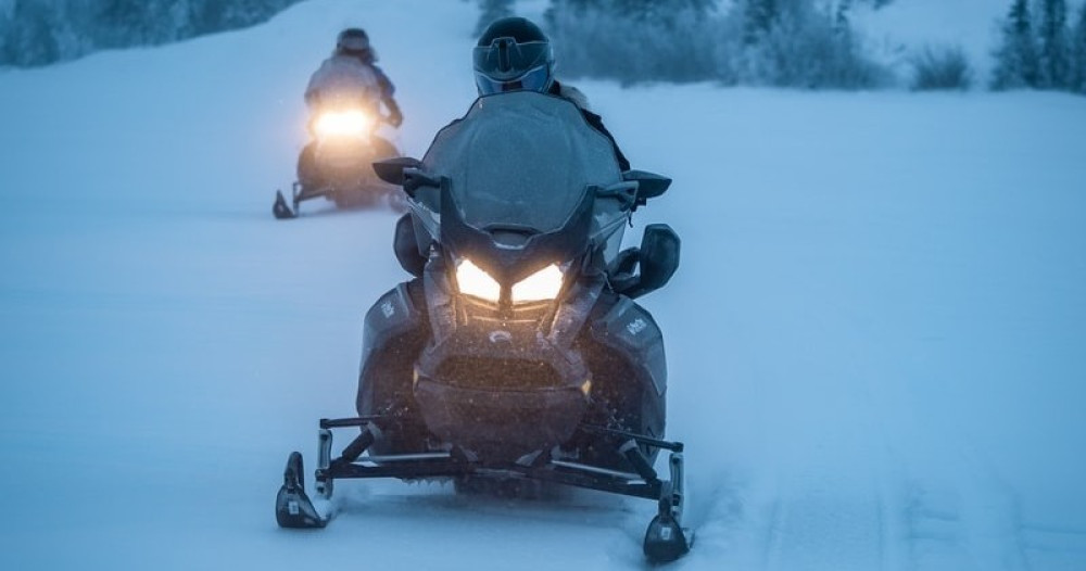 Overnight Snowmobile Adventure with Riverside Cabin & Sauna