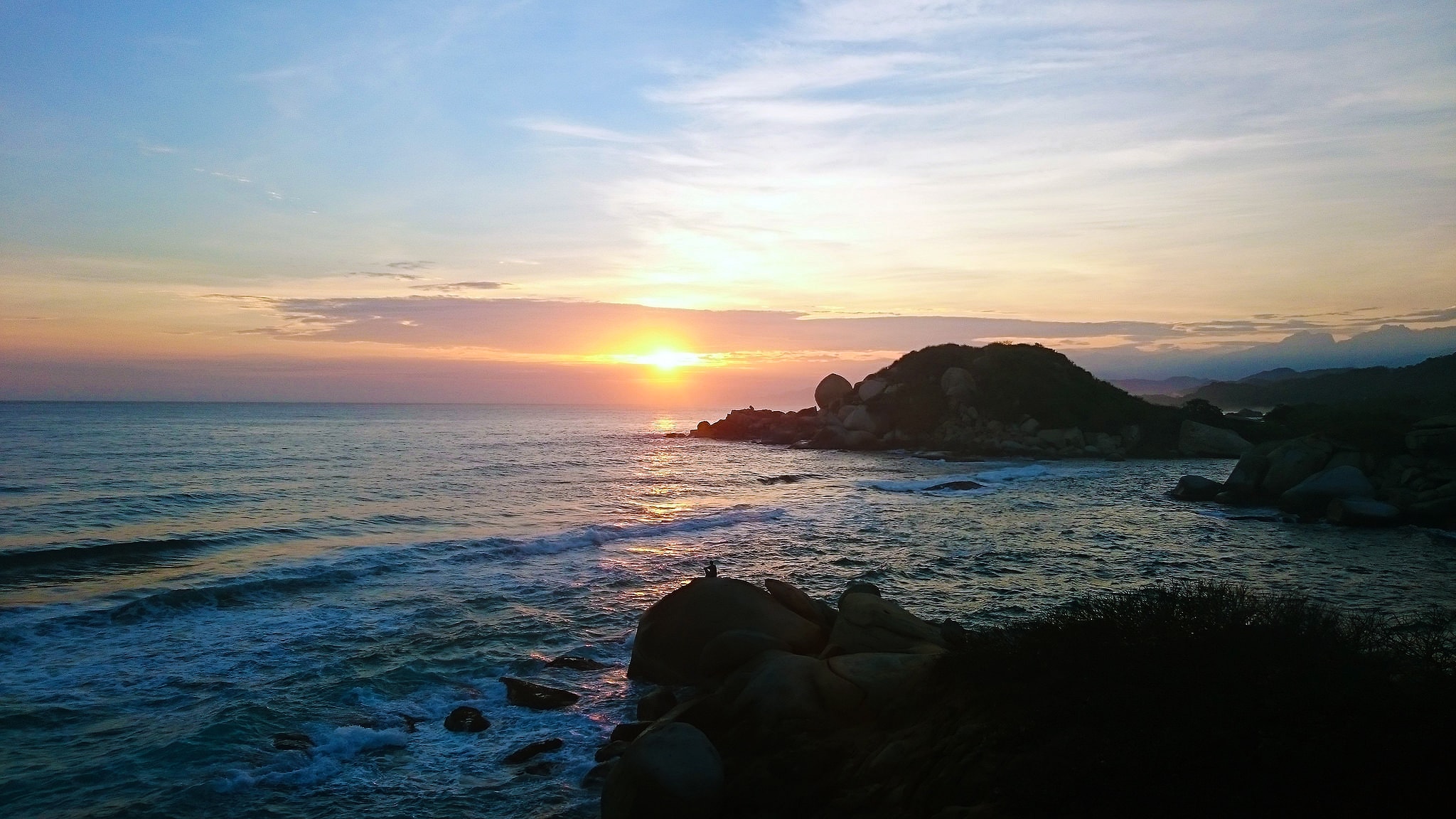 Tayrona Colombia colorful sunrise on the beach